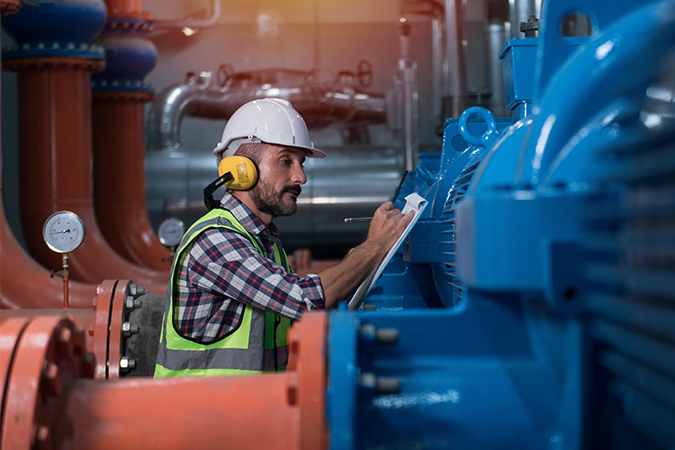 Man checking pump parts