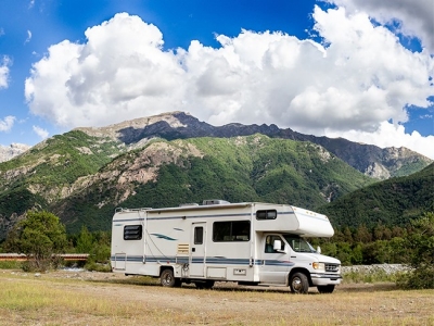RV driving through mountains; Adobe Stock: 247416468