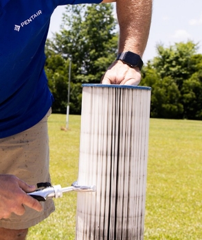 Pleatco filter cartridge being cleaned