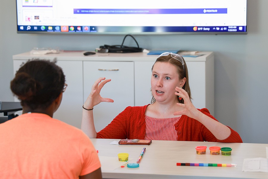 photo of Pentair employee teaching a young girl
